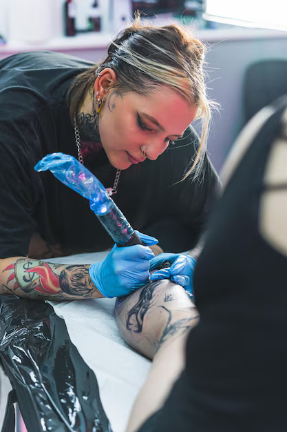 vertical shot female tattoo artist her work busy day tattooing studio girl holding 609103 1437 vertical shot female tattoo artist her work busy day tattooing studio girl holding 609103 1437
